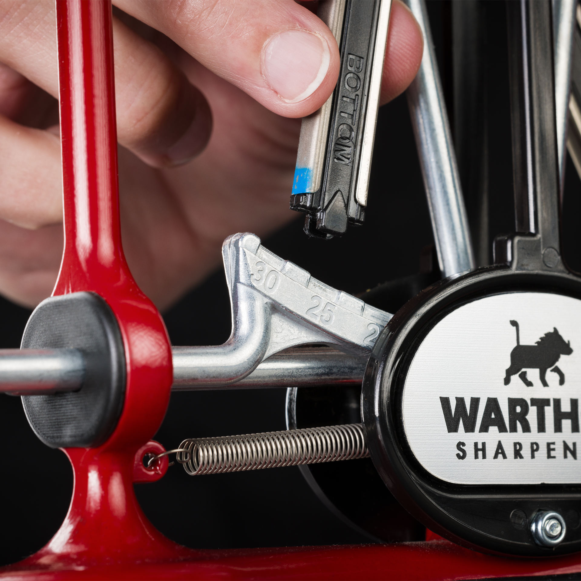 Inserting a sharpening unit into the V-Sharp A4 knife sharpener